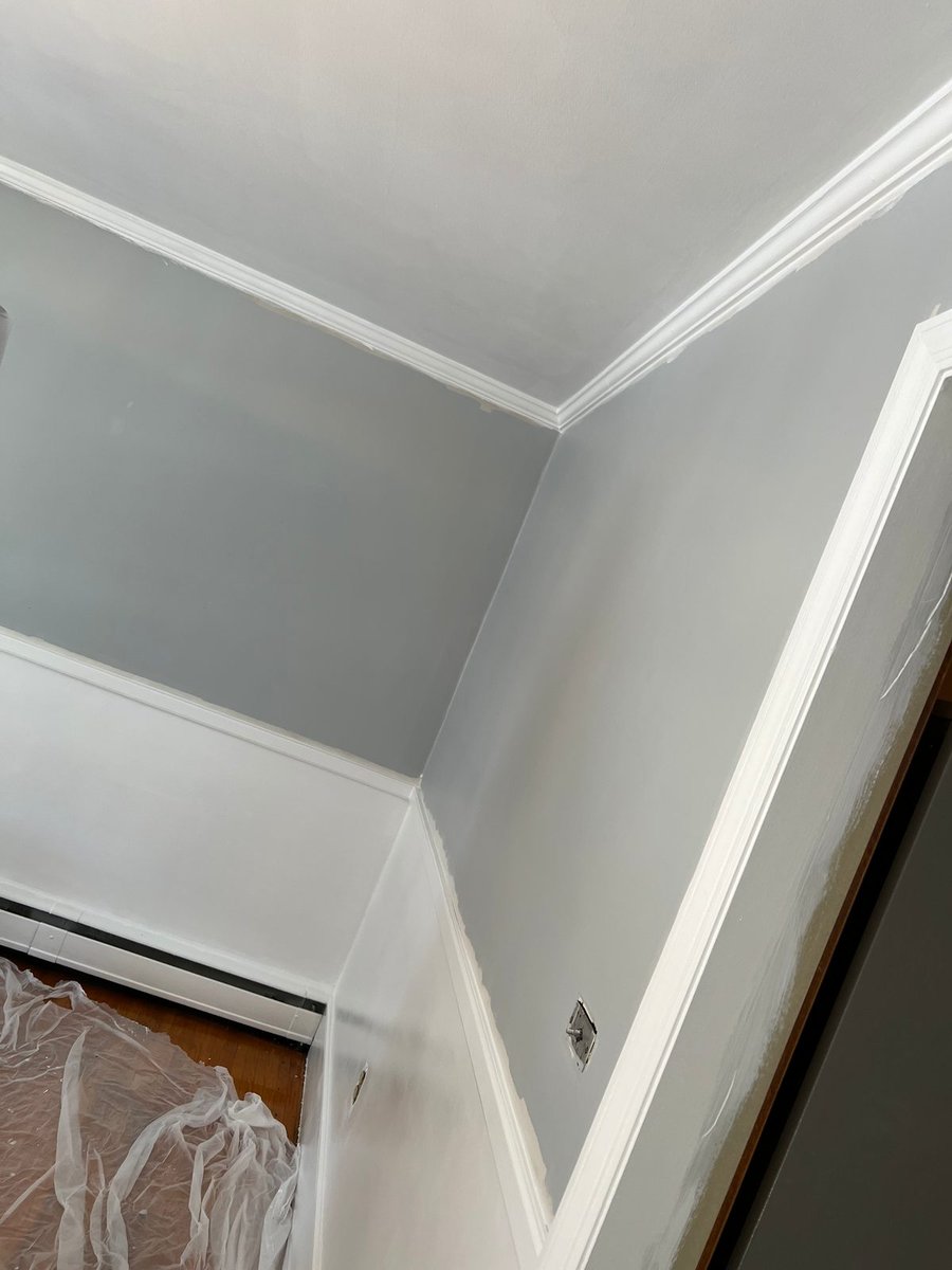 Interior after repair — walls skim-coated, primed and painted